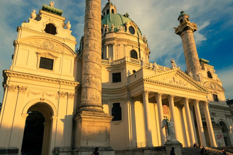 Panoramic view of Vienna's historic skyline with baroque domes and rooftops bathed in warm golden light