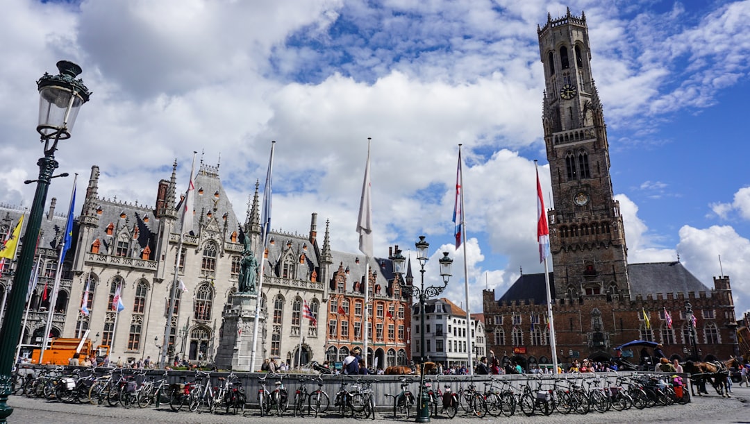 Bruges Belfry tower and medieval Cloth Hall at the Markt square in late afternoon light