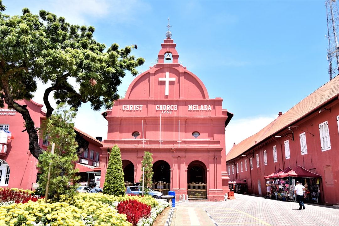 The red Stadthuys and Christ Church in Malacca's Dutch Square at golden hour