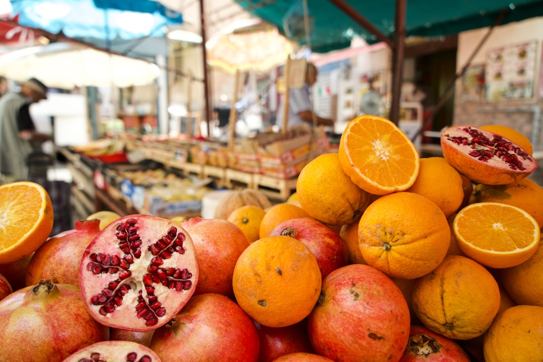 Vendor arranging prickly pears at a street market in Palermo Sicily