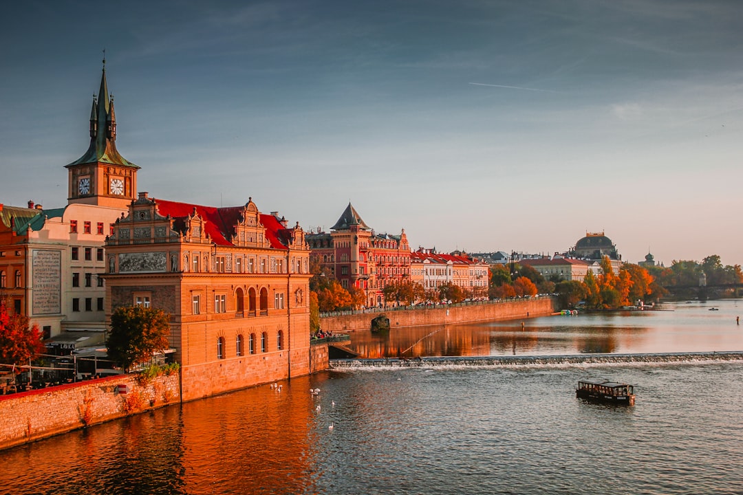 Art Nouveau apartment façades along Masarykovo nábřeží embankment in Prague at golden hour