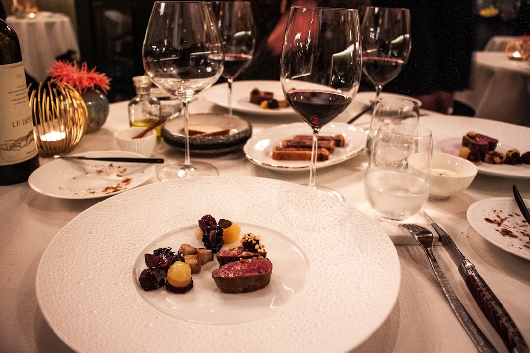 Plated dish and wine at a Canberra restaurant showcasing the city's dining scene
