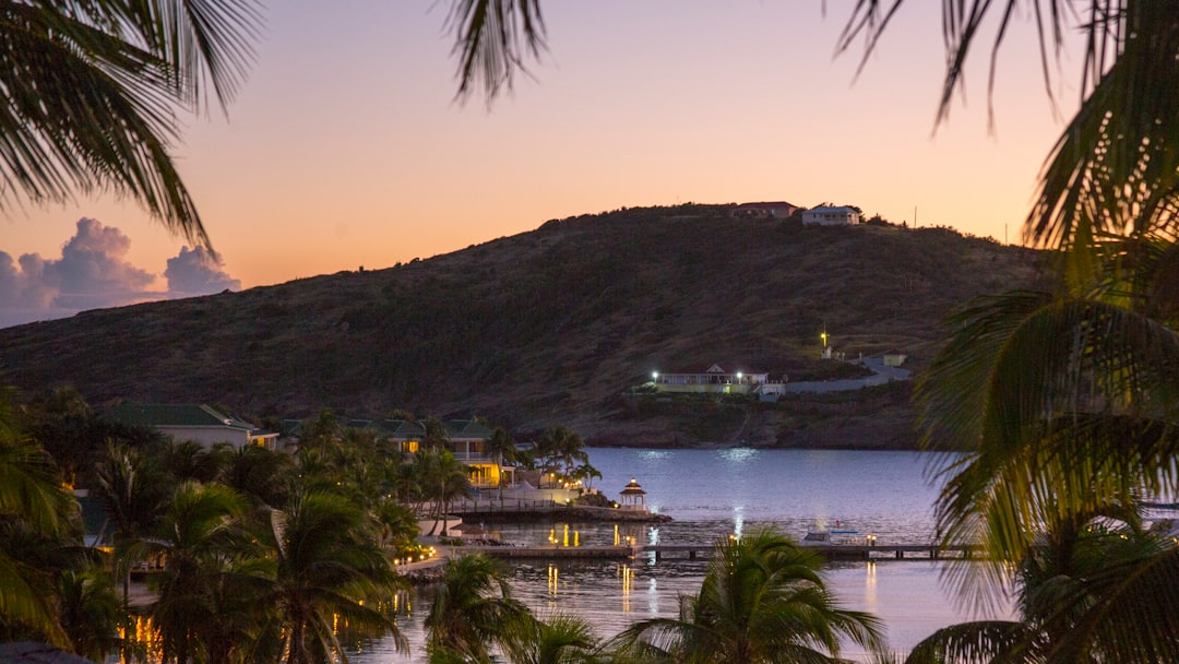 Late-afternoon light over a sheltered bay on Antigua's southeast coast