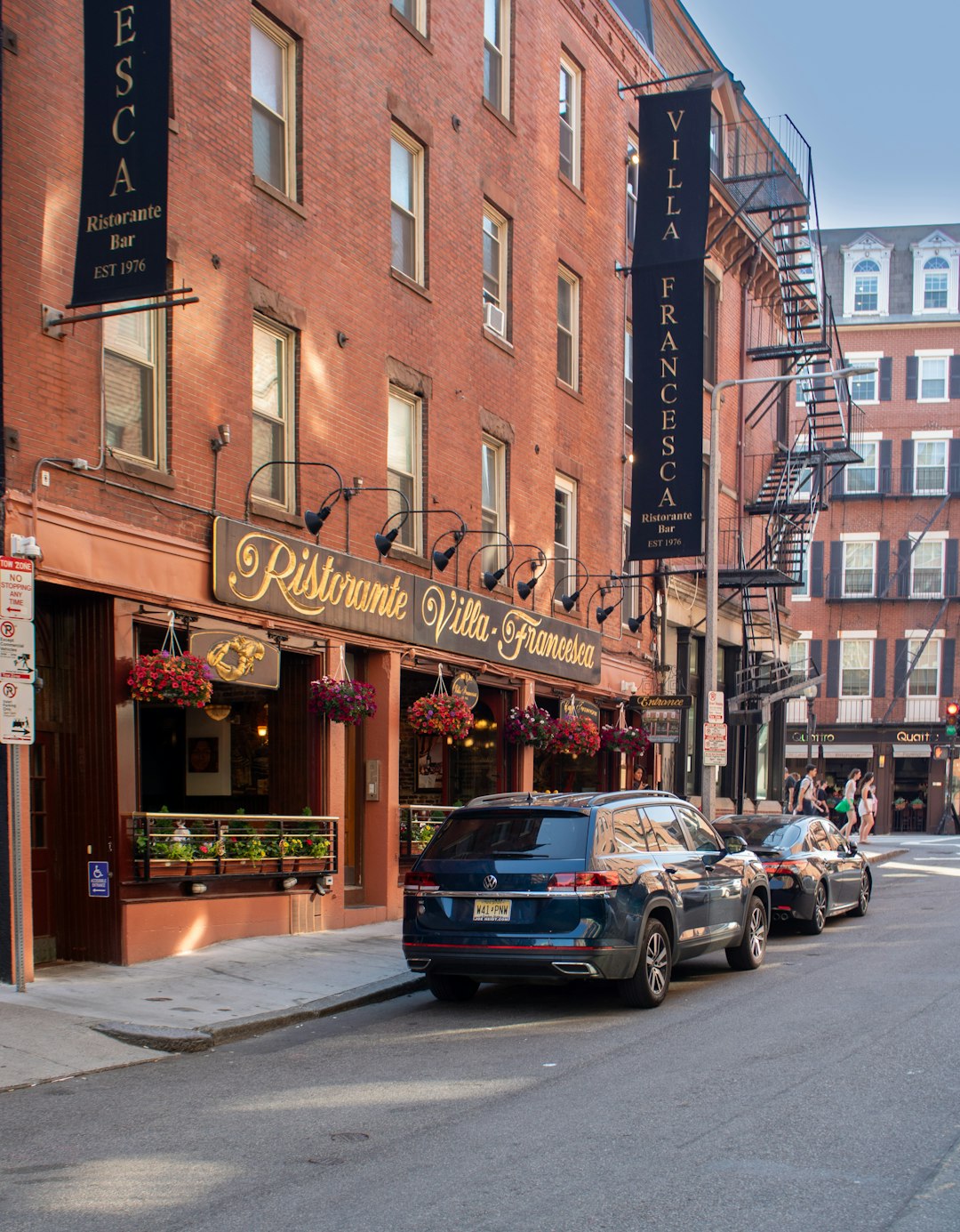 Italian restaurant fronts on a brick street in Boston's North End