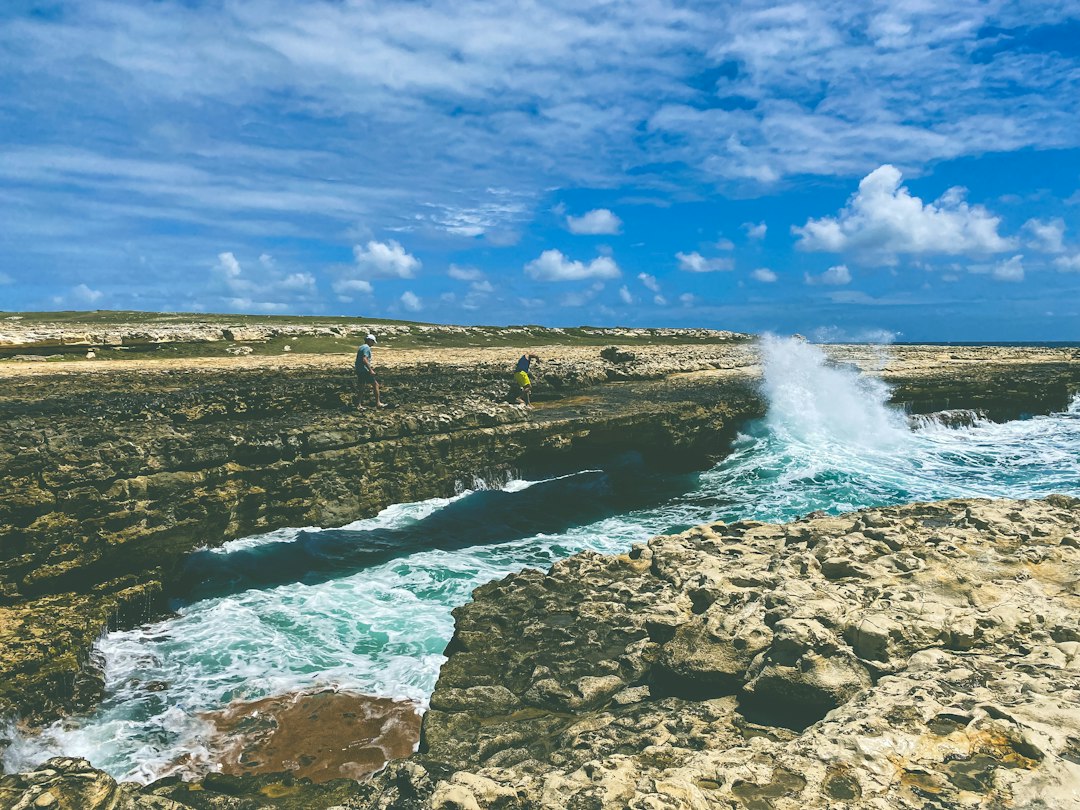 Waves breaking over the limestone shelf at Devil's Bridge on Antigua's east coast
