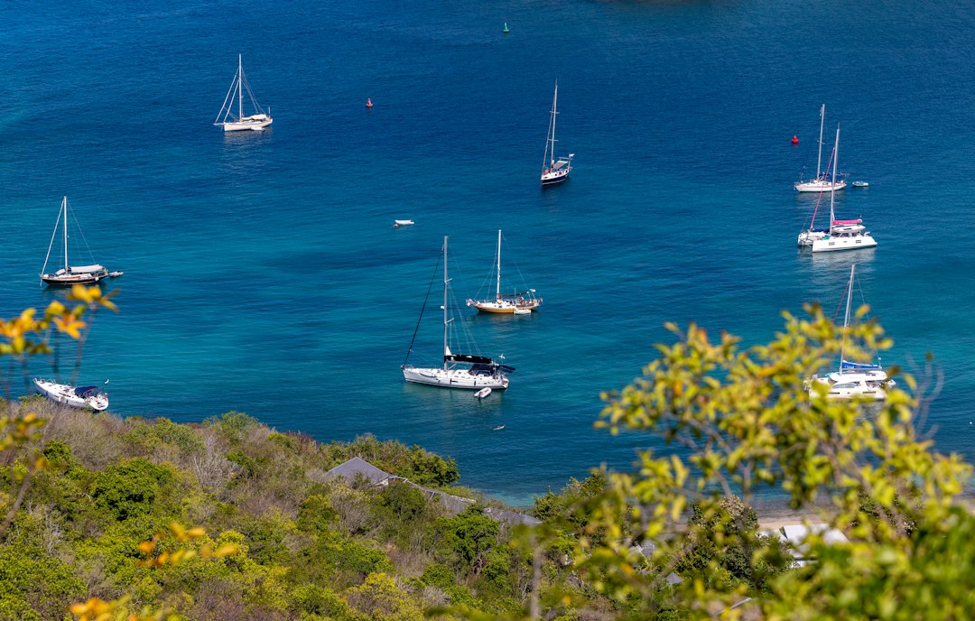 Sailboats anchored in a turquoise bay off Antigua